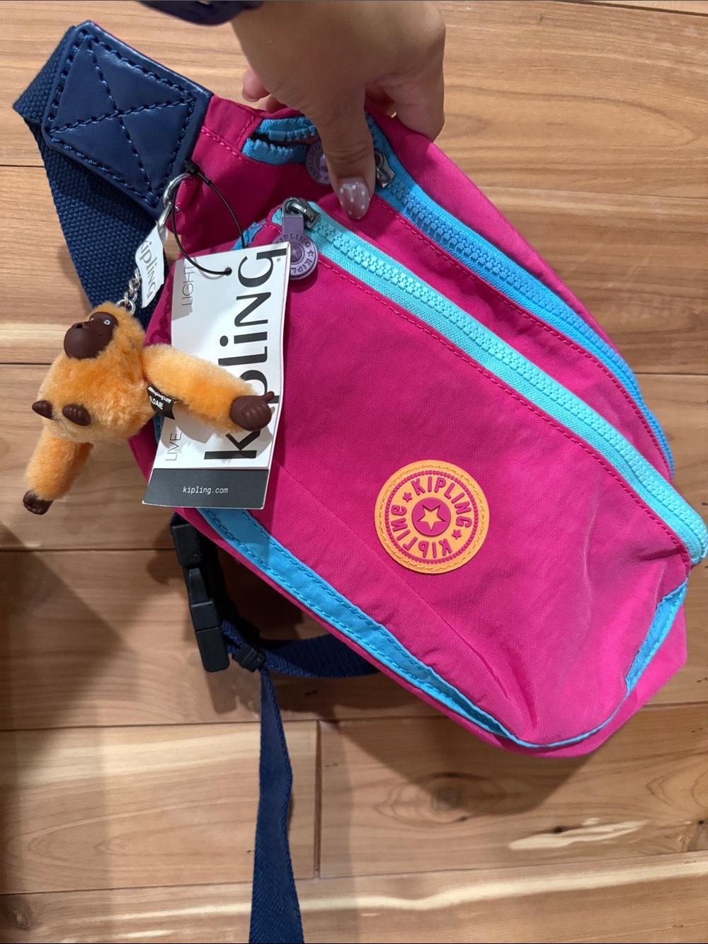 Kipling Pink with Blue Trim Sling Crossbody